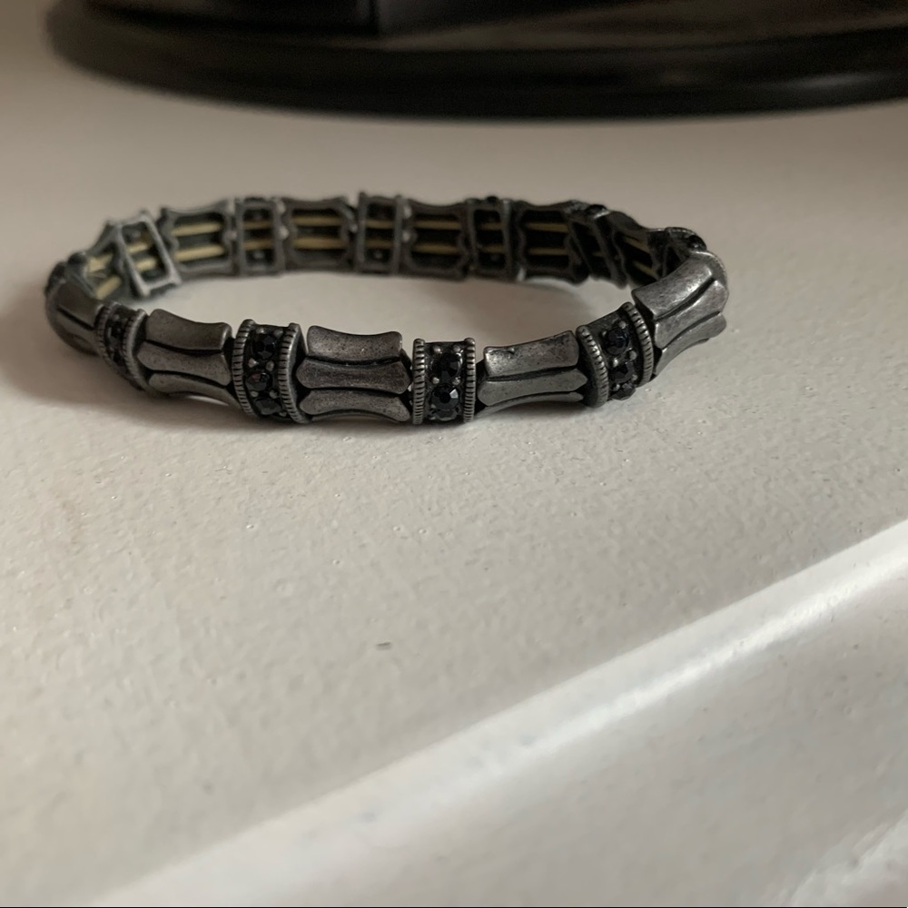 Silver bracelet with small black beads